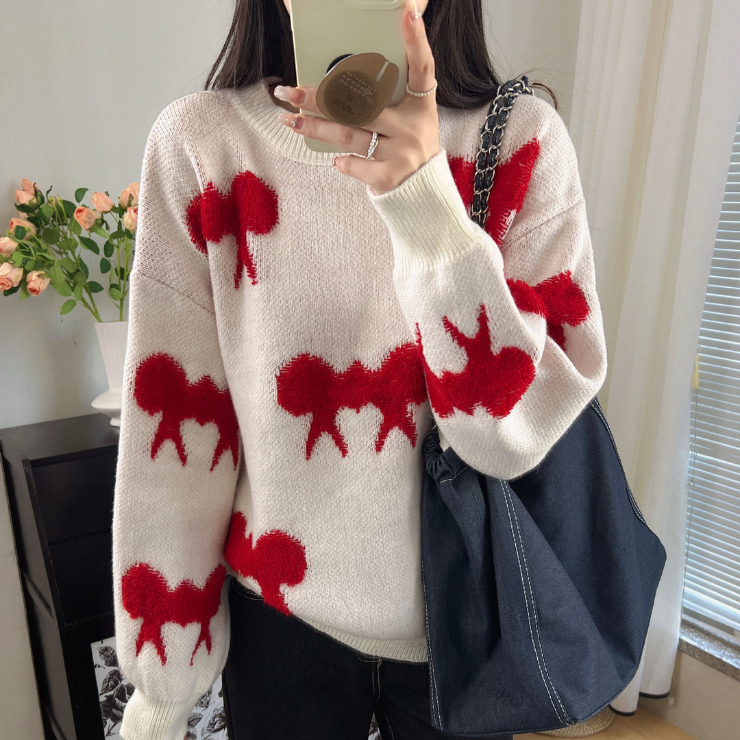 Kvinnors stickad pullover med lekfullt djurmotiv och avslappnad passform Mirla-Eva Jonsson