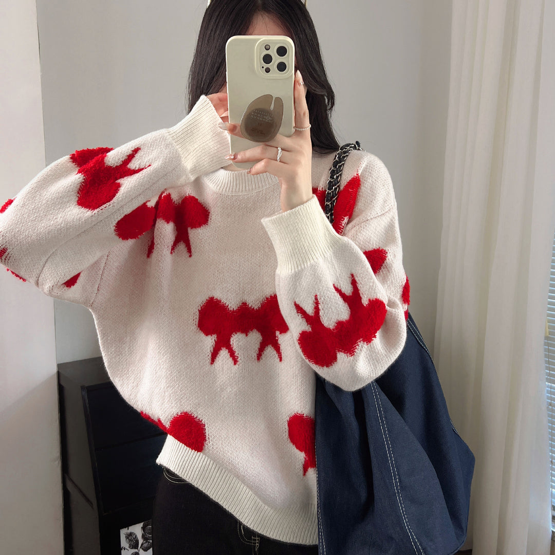 Kvinnors stickad pullover med lekfullt djurmotiv och avslappnad passform Mirla-Eva Jonsson