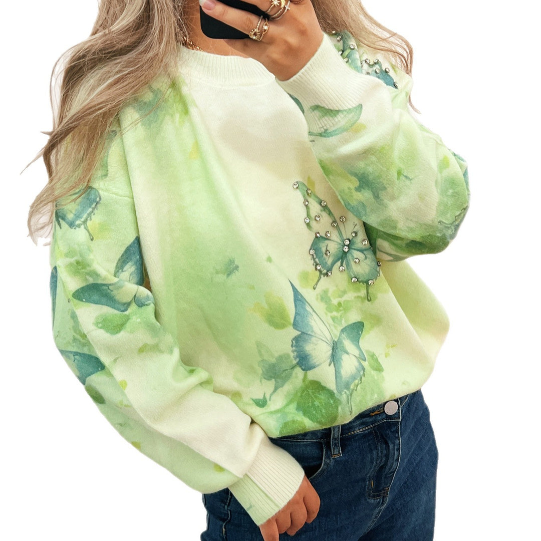 Kvinnors stickad pullover med skimrande fjäril-applikationer Mirla-Eva Jonsson