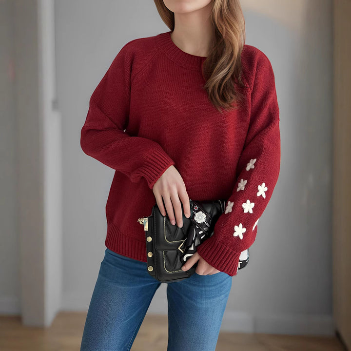 Kvinnors stickad tröja med blommiga applikationer och avslappnad passform Mirla-Eva Jonsson