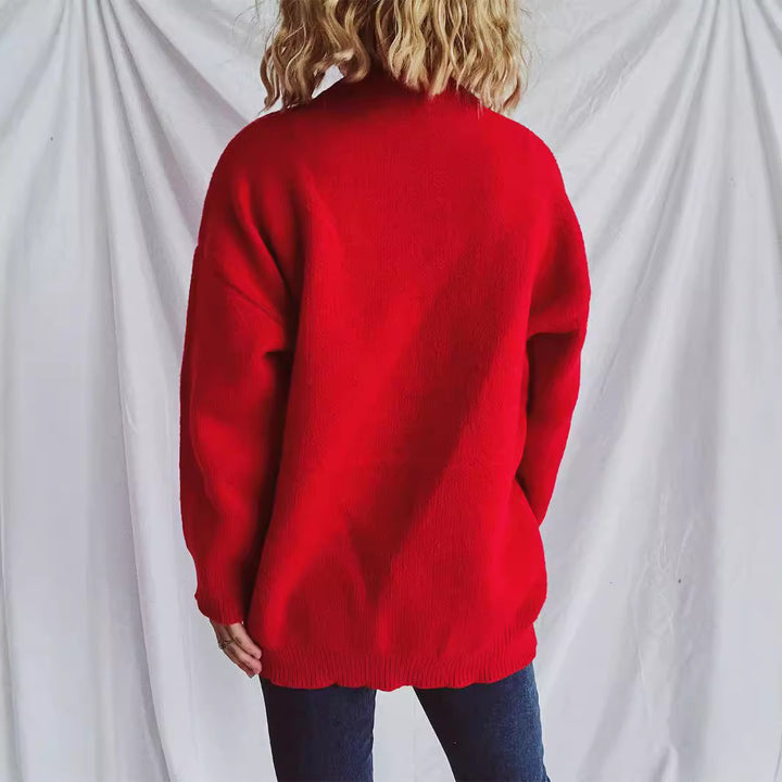 Kvinnors stickad tröja med charmigt hjärtformad design och dekorativ rosett Mirla-Eva Jonsson