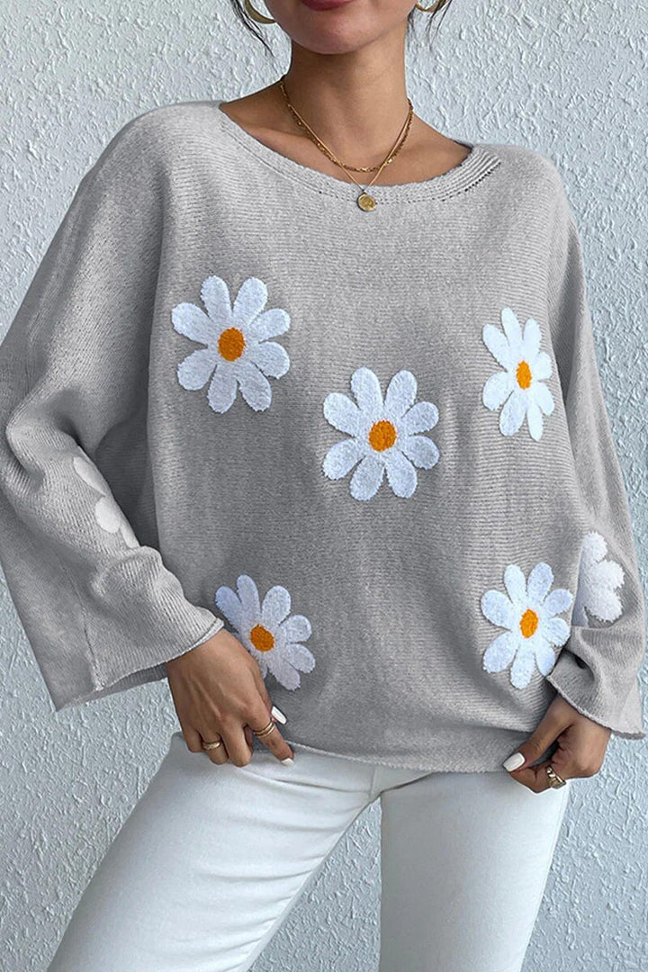 Kvinnors stickad tröja med lekfull blomsterdesign och lös passform Mirla-Eva Jonsson