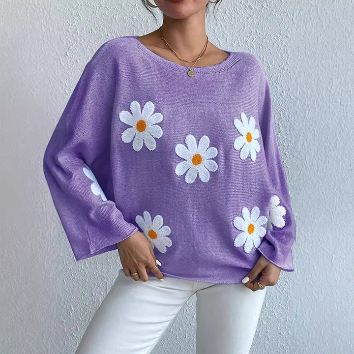 Kvinnors stickad tröja med lekfull blomsterdesign och lös passform Mirla-Eva Jonsson