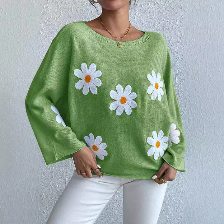 Kvinnors stickad tröja med lekfull blomsterdesign och lös passform Mirla-Eva Jonsson