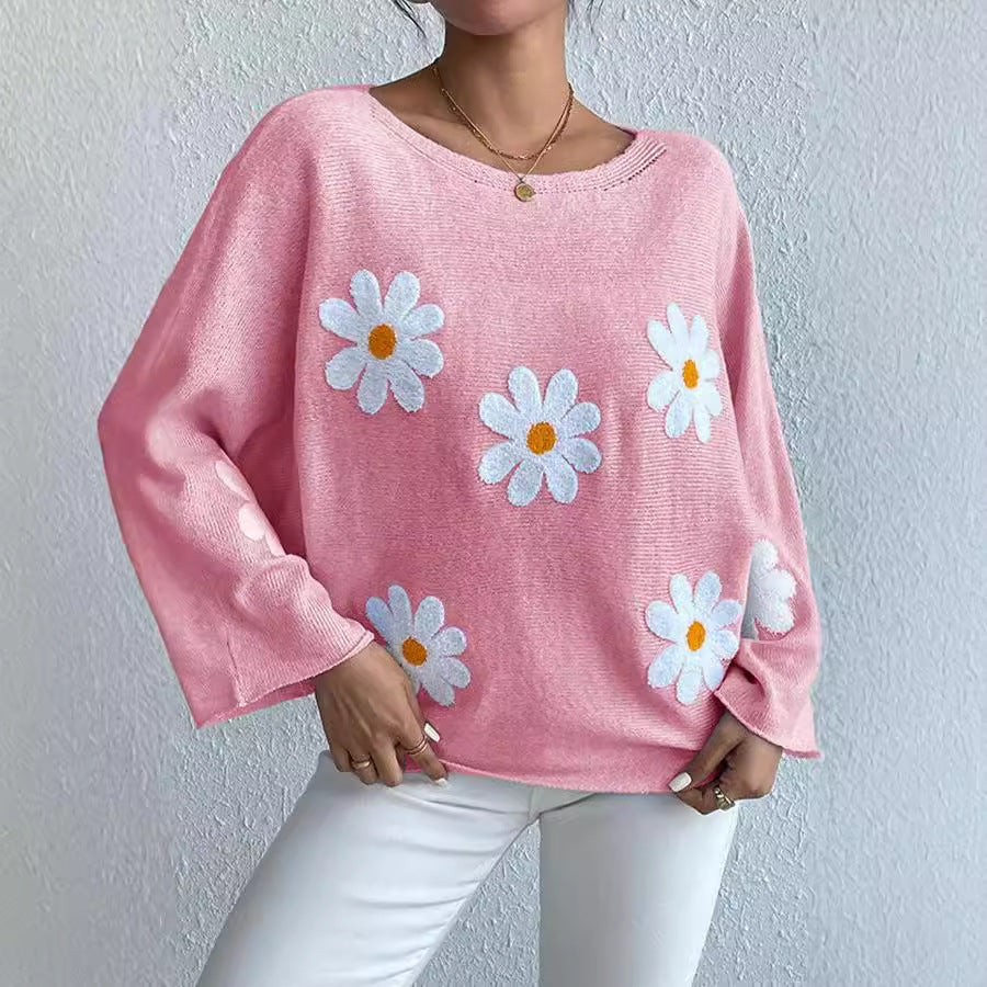 Kvinnors stickad tröja med lekfull blomsterdesign och lös passform Mirla-Eva Jonsson
