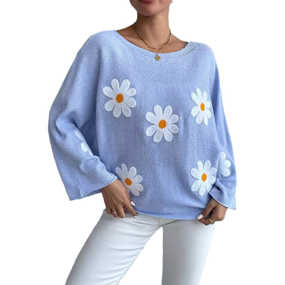 Kvinnors stickad tröja med lekfull blomsterdesign och lös passform Mirla-Eva Jonsson