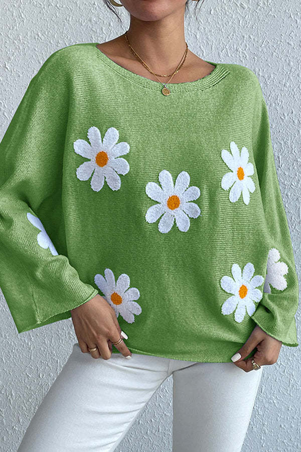 Kvinnors stickad tröja med lekfull blomsterdesign och lös passform Mirla-Eva Jonsson