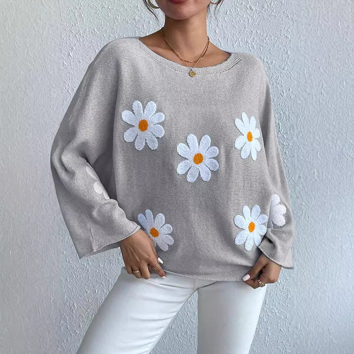 Kvinnors stickad tröja med lekfull blomsterdesign och lös passform Mirla-Eva Jonsson