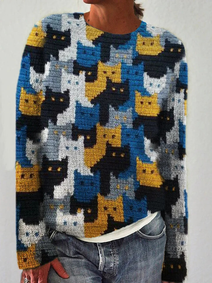 Kvinnors stickad tröja med lekfullt kattmönster Mirla-Eva Jonsson