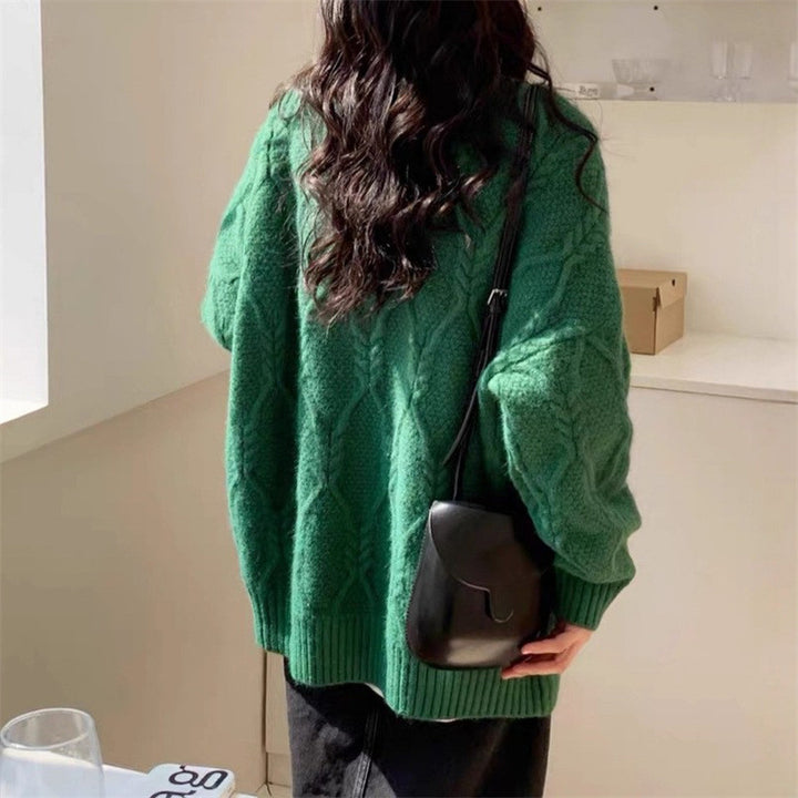 Kvinnors stickade tröja med flätad design och avslappnad passform Mirla-Eva Jonsson