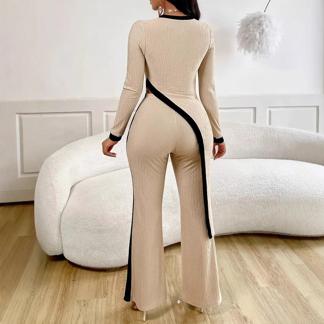Kvinnors stiliga jumpsuit med asymmetrisk design och kontrasterande piping Mirla-Eva Jonsson