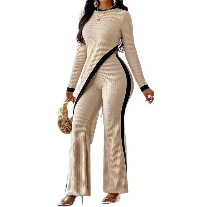 Kvinnors stiliga jumpsuit med asymmetrisk design och kontrasterande piping Mirla-Eva Jonsson