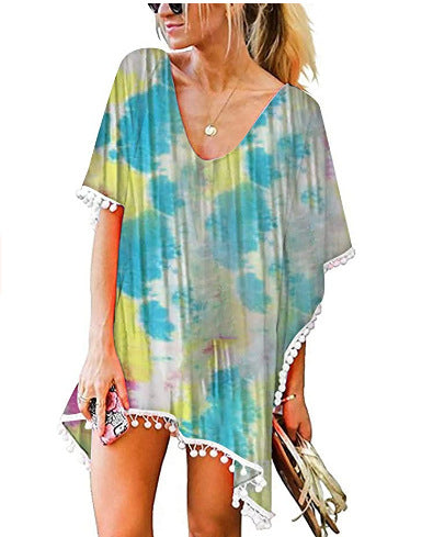 Kvinnors strandtunika med blommönster och poncho-stil Mirla-Eva Jonsson