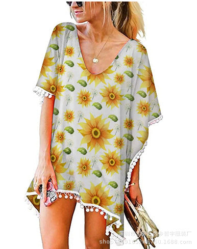 Kvinnors strandtunika med blommönster och poncho-stil Mirla-Eva Jonsson