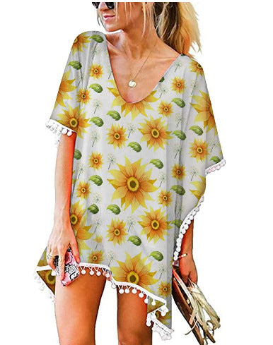 Kvinnors strandtunika med blommönster och poncho-stil Mirla-Eva Jonsson