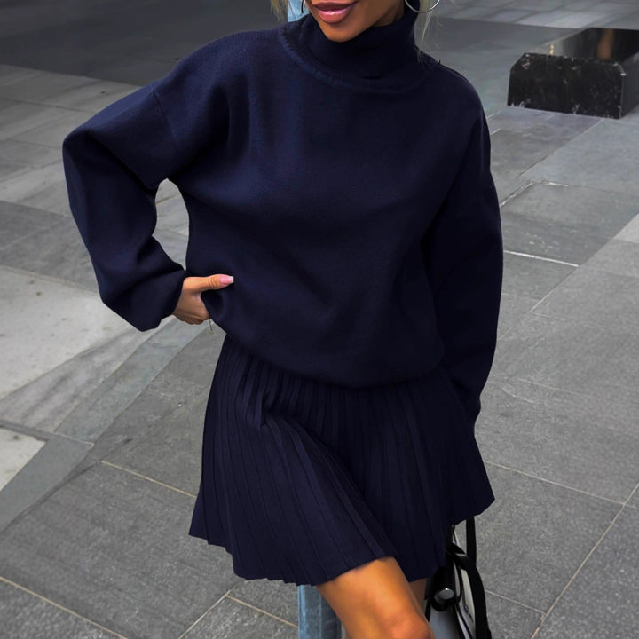 Kvinnors styling set med avslappnad tröja och veckad kjol Mirla-Eva Jonsson