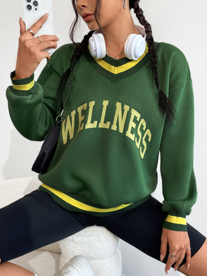 Kvinnors sweatshirt med V-hals och kreativ wellnesstryck Mirla-Eva Jonsson