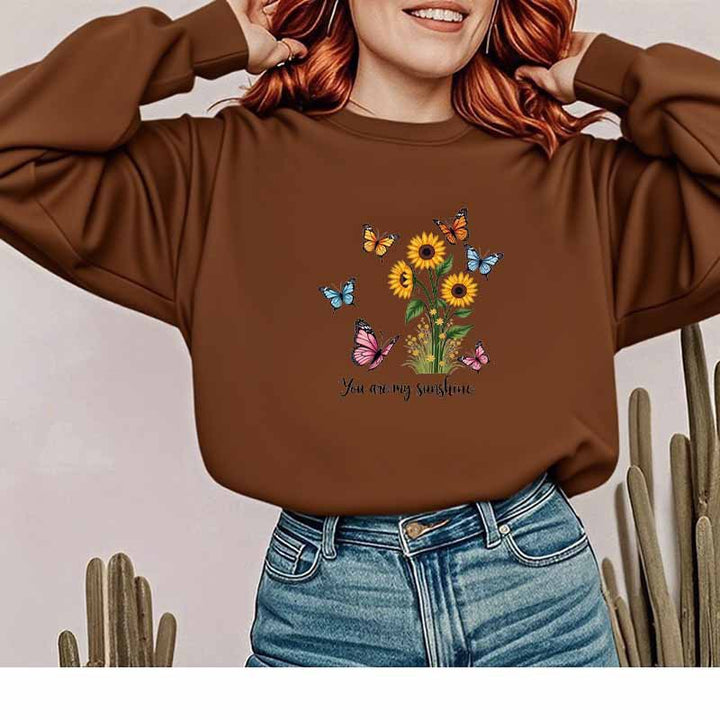 Kvinnors sweatshirt med blommig design och motiverande tryck Mirla-Eva Jonsson