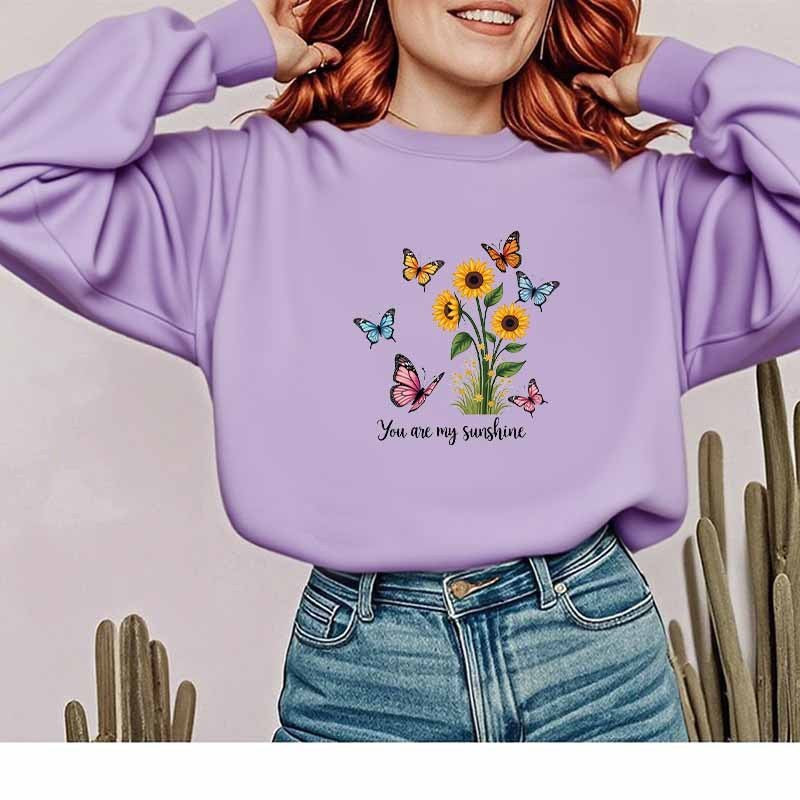 Kvinnors sweatshirt med blommig design och motiverande tryck Mirla-Eva Jonsson