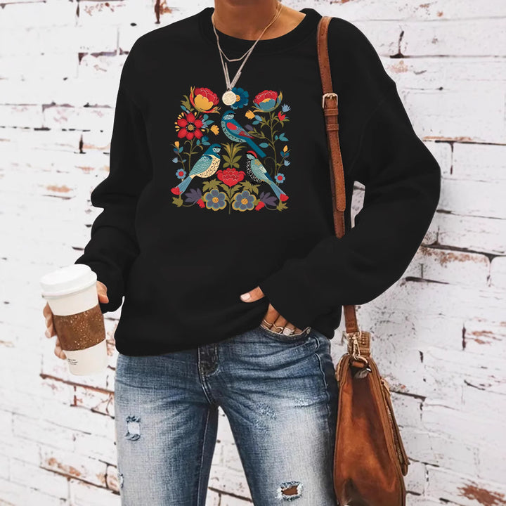Kvinnors sweatshirt med blommigt fågelmotiv och avslappnad passform Mirla-Eva Jonsson