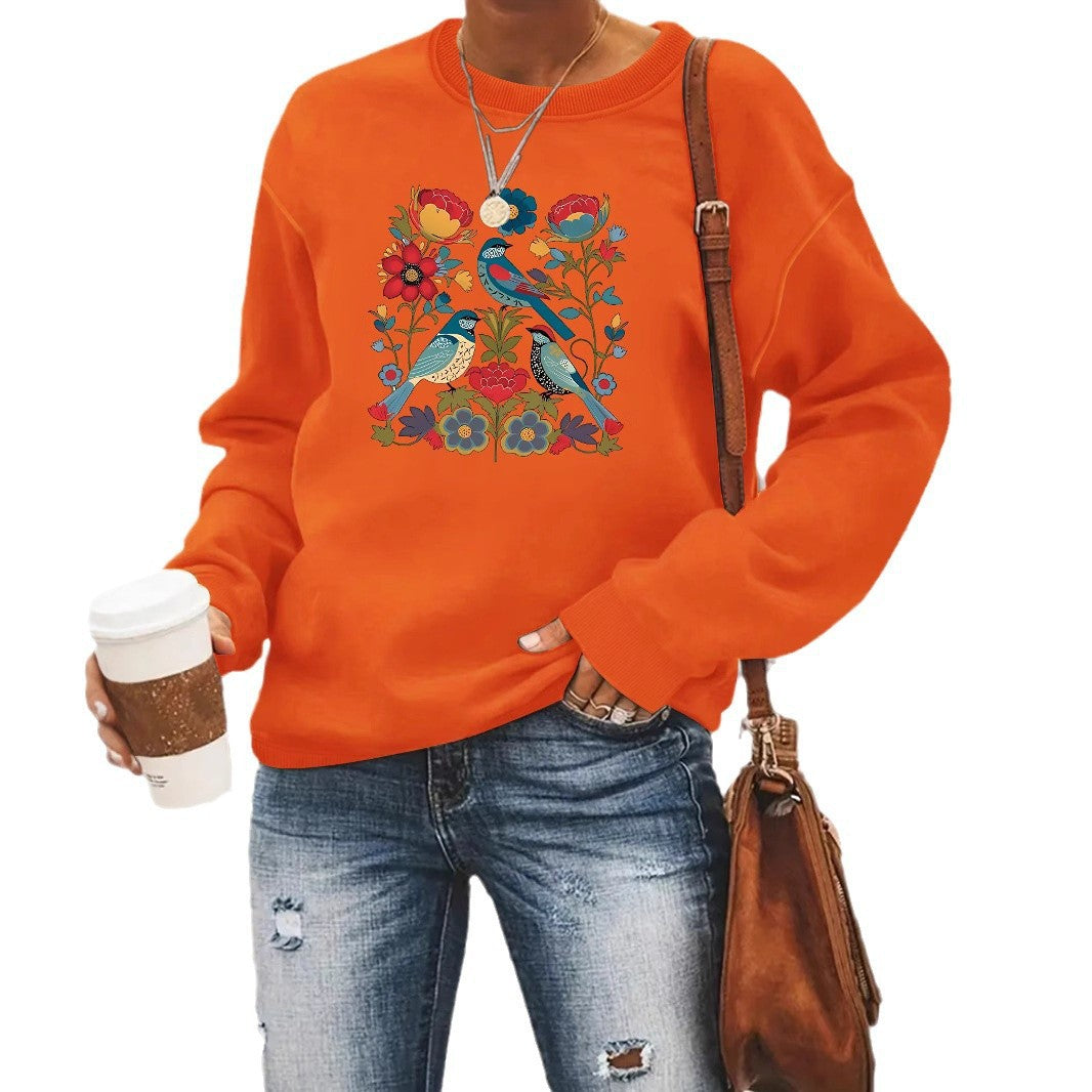 Kvinnors sweatshirt med blommigt fågelmotiv och avslappnad passform Mirla-Eva Jonsson