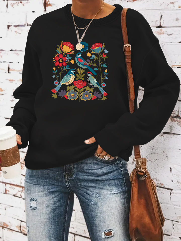 Kvinnors sweatshirt med blommigt fågelmotiv och avslappnad passform Mirla-Eva Jonsson