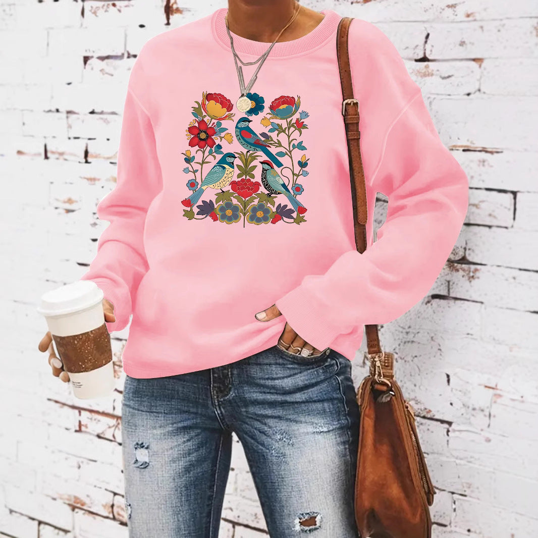 Kvinnors sweatshirt med blommigt fågelmotiv och avslappnad passform Mirla-Eva Jonsson