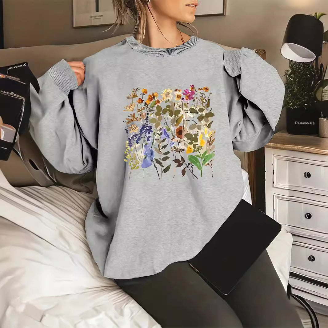 Kvinnors sweatshirt med blommönster och bekväm passform Mirla-Eva Jonsson