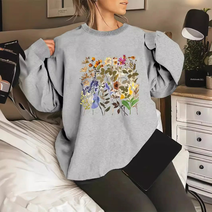 Kvinnors sweatshirt med blommönster och bekväm passform Mirla-Eva Jonsson