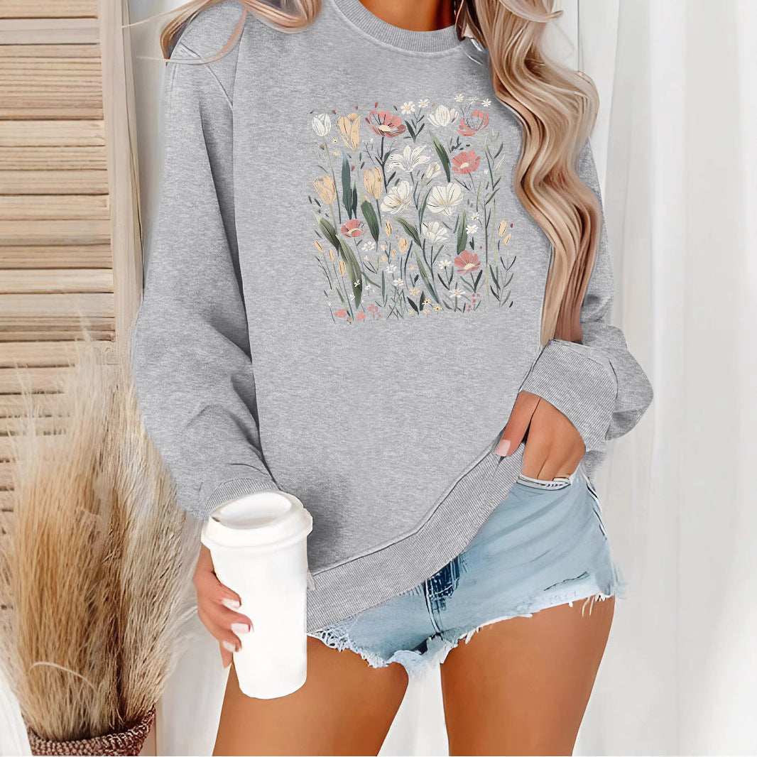 Kvinnors sweatshirt med blommotiv och avslappnad passform Mirla-Eva Jonsson