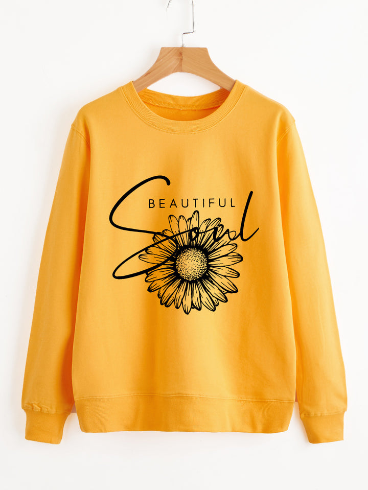 Kvinnors sweatshirt med blommotiv och inspirerande text Mirla-Eva Jonsson