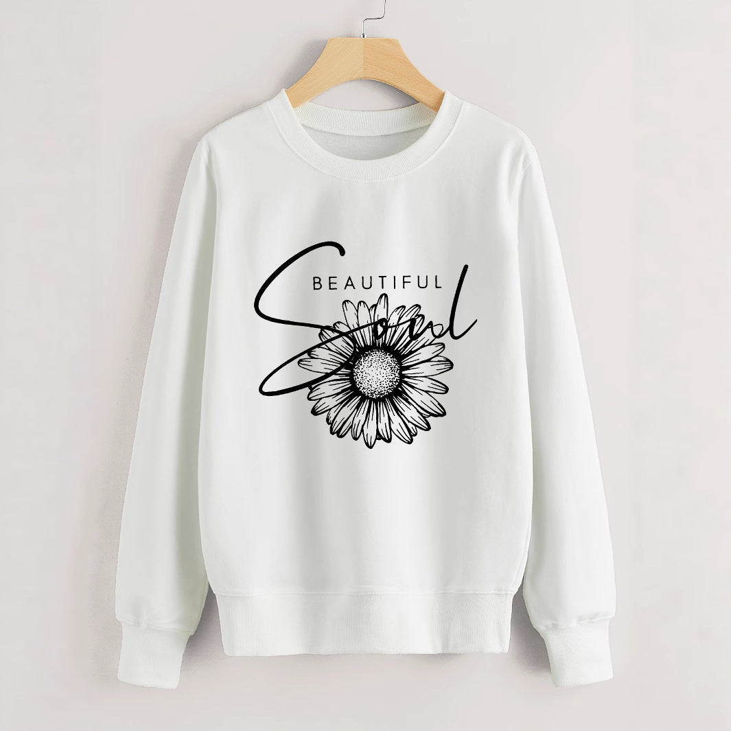 Kvinnors sweatshirt med blommotiv och inspirerande text Mirla-Eva Jonsson