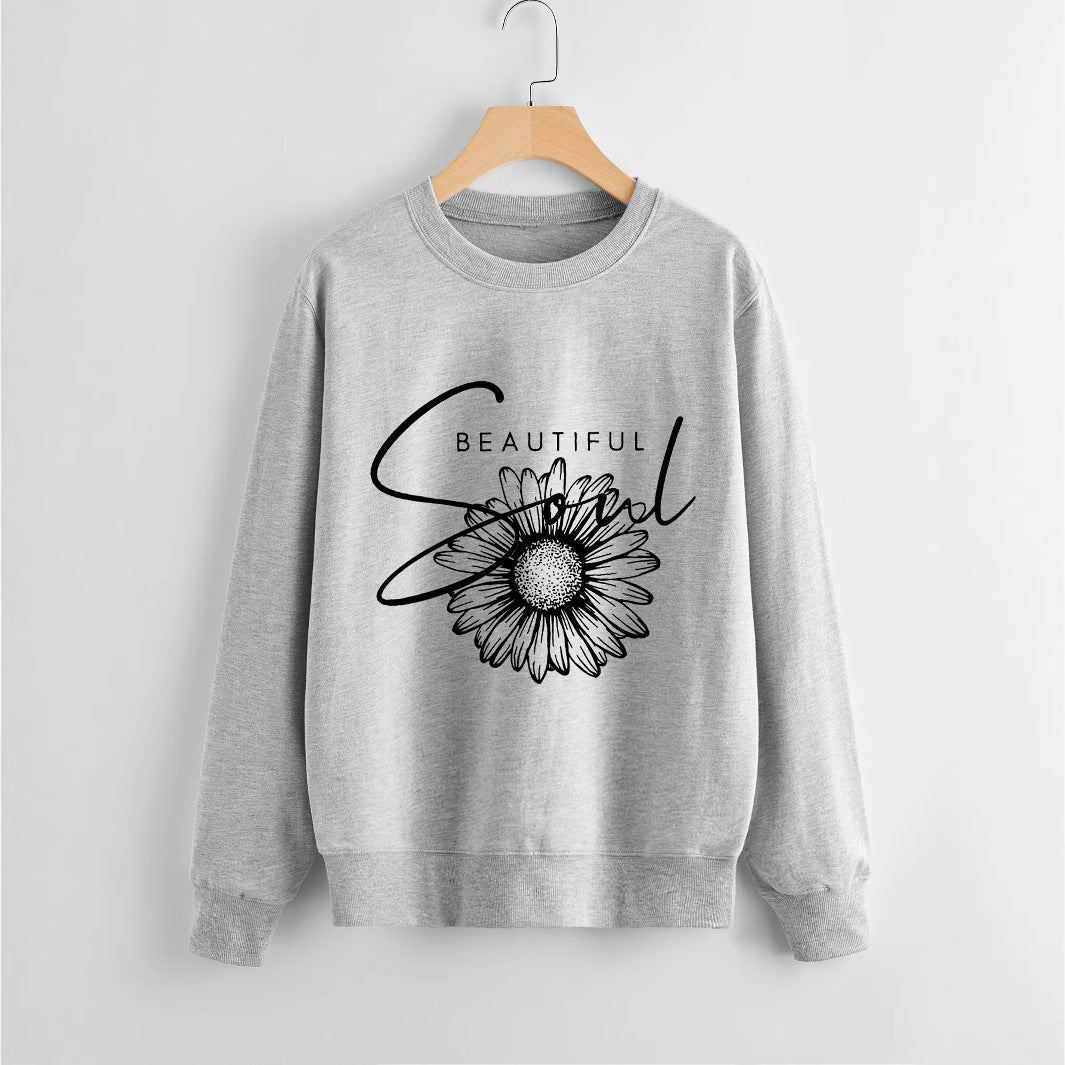 Kvinnors sweatshirt med blommotiv och inspirerande text Mirla-Eva Jonsson