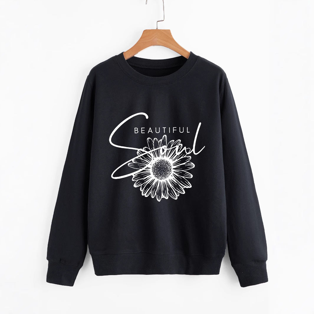 Kvinnors sweatshirt med blommotiv och inspirerande text Mirla-Eva Jonsson