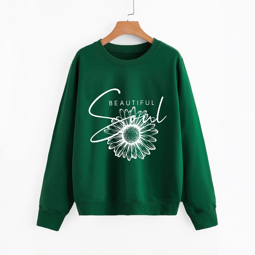 Kvinnors sweatshirt med blommotiv och inspirerande text Mirla-Eva Jonsson