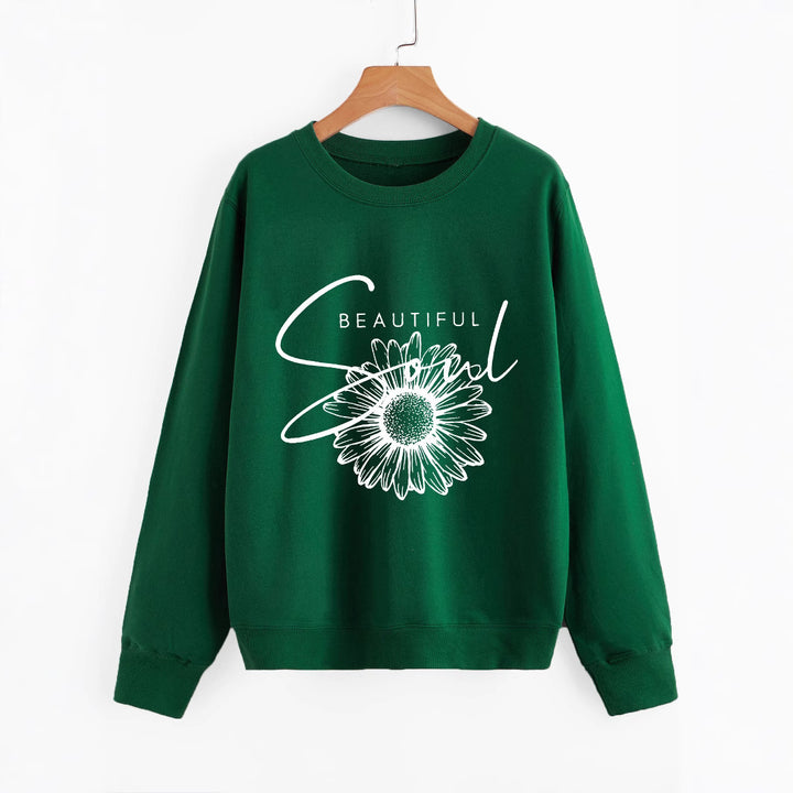 Kvinnors sweatshirt med blommotiv och inspirerande text Mirla-Eva Jonsson