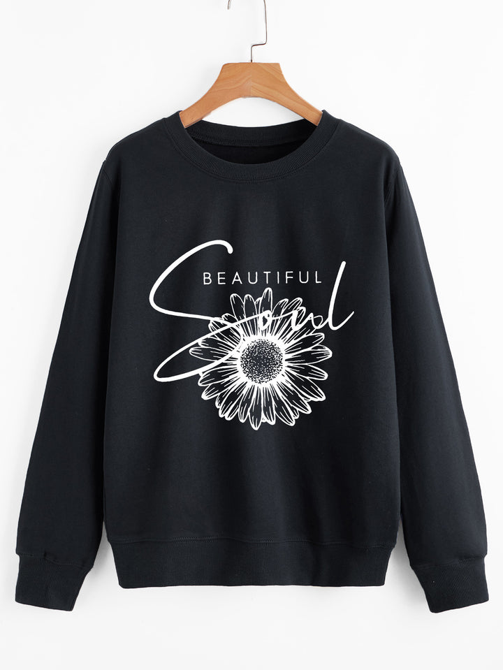 Kvinnors sweatshirt med blommotiv och inspirerande text Mirla-Eva Jonsson