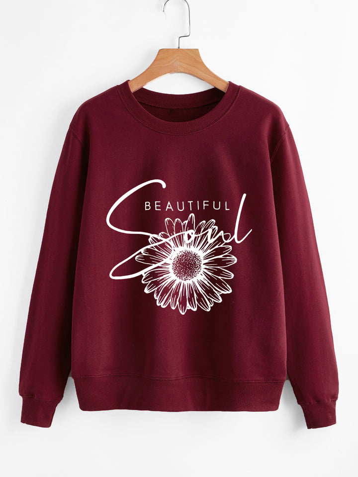 Kvinnors sweatshirt med blommotiv och inspirerande text Mirla-Eva Jonsson