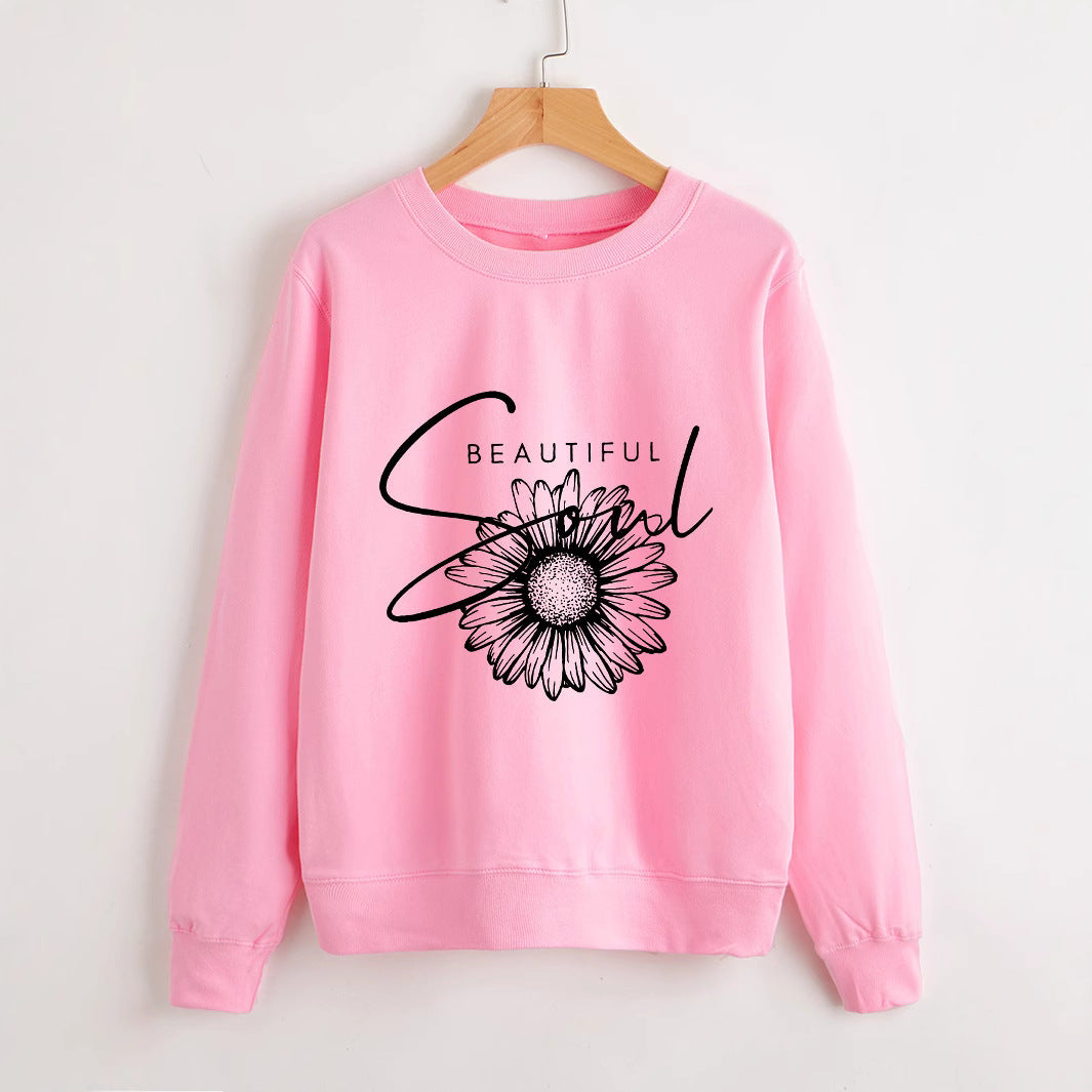 Kvinnors sweatshirt med blommotiv och inspirerande text Mirla-Eva Jonsson