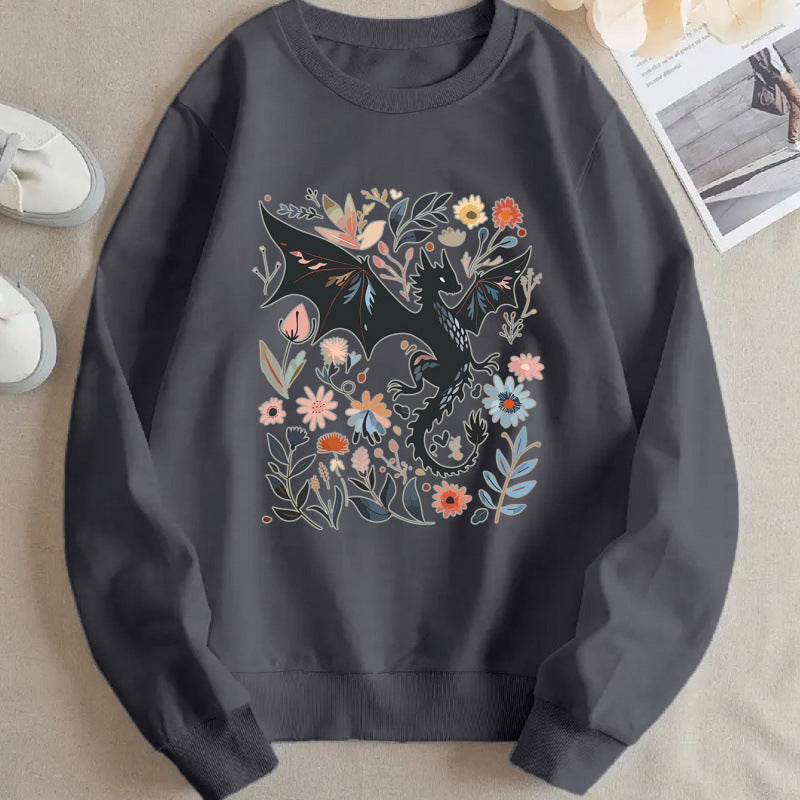Kvinnors sweatshirt med detaljerad drake- och blommotiv Mirla-Eva Jonsson