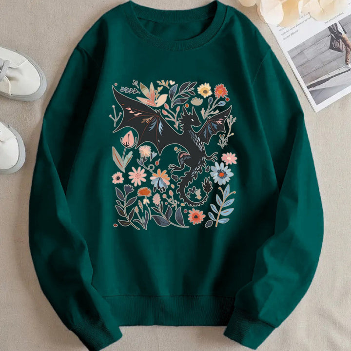 Kvinnors sweatshirt med detaljerad drake- och blommotiv Mirla-Eva Jonsson