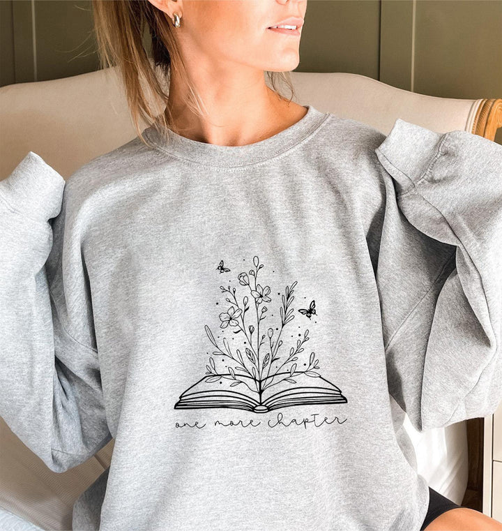 Kvinnors sweatshirt med elegant blommönster och inspirerande tryck Mirla-Eva Jonsson