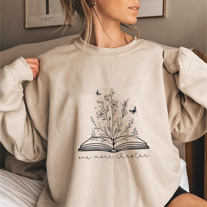 Kvinnors sweatshirt med elegant blommönster och inspirerande tryck Mirla-Eva Jonsson