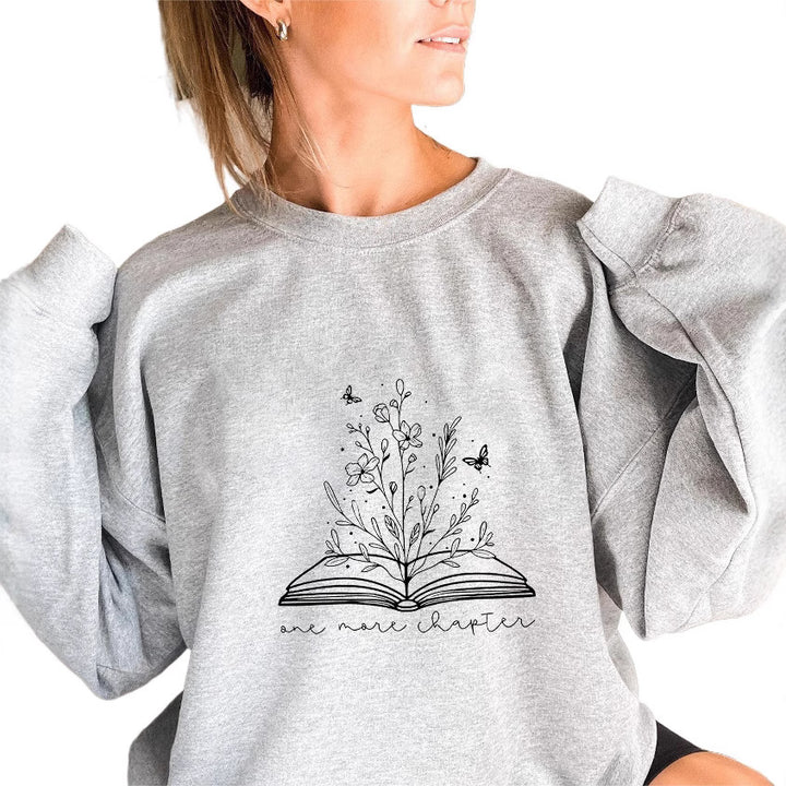 Kvinnors sweatshirt med elegant blommönster och inspirerande tryck Mirla-Eva Jonsson