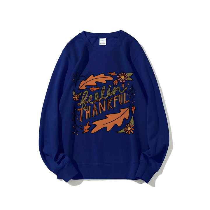 Kvinnors sweatshirt med färgglad höstmotiv och inspirerande text Mirla-Eva Jonsson