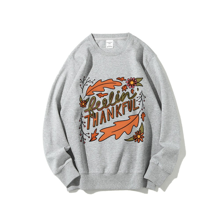 Kvinnors sweatshirt med färgglad höstmotiv och inspirerande text Mirla-Eva Jonsson