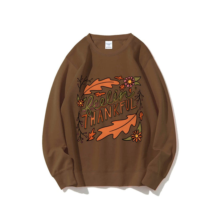 Kvinnors sweatshirt med färgglad höstmotiv och inspirerande text Mirla-Eva Jonsson