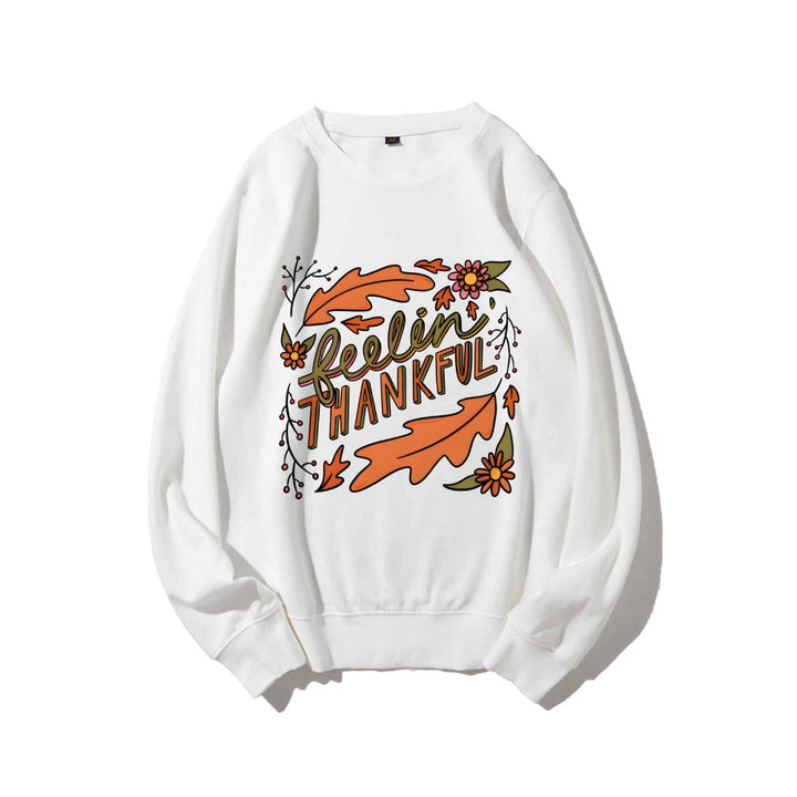 Kvinnors sweatshirt med färgglad höstmotiv och inspirerande text Mirla-Eva Jonsson