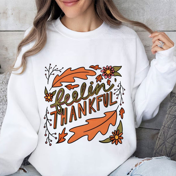 Kvinnors sweatshirt med färgglad höstmotiv och inspirerande text Mirla-Eva Jonsson