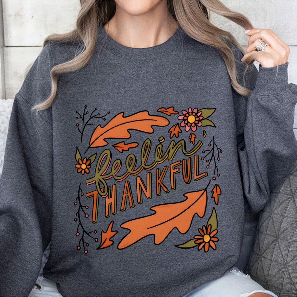 Kvinnors sweatshirt med färgglad höstmotiv och inspirerande text Mirla-Eva Jonsson